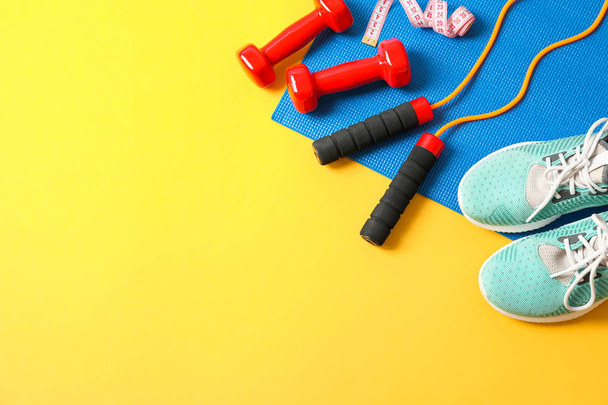 Flat lay composition with healthy lifestyle accessories on color - 写真・画像