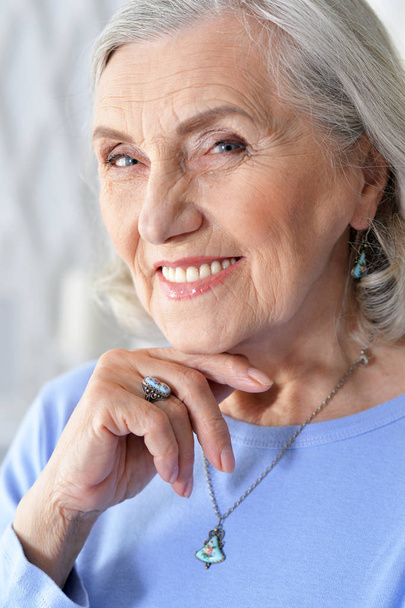 portrait of happy senior woman at home - Fotografie, Obrázek