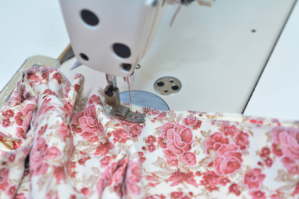 Seamstress working on sewing machine - Photo, Image