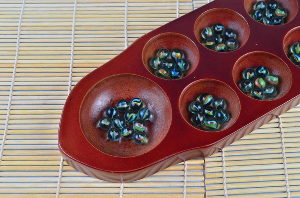Congkak (szelektív összpontosít és sekély Dof), egy hagyományos játék Ázsia - Fotó, kép