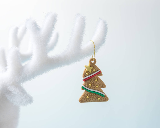 White reindeer antler with Christmas decoration on white background. Christmas or New Year minimal concept. - Valokuva, kuva