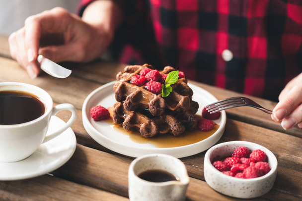 Belgian chocolate waffles with syrup and berries - Fotó, kép