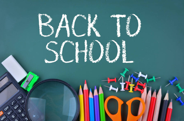 School supplies on chalkboard with text Back to School - Photo, Image