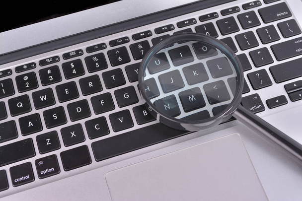 Laptop computer with magnifying glass, concept of search - Photo, Image