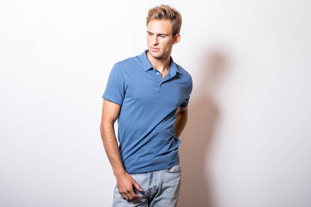 Elegant young handsome man in stylish blue shirt. - Foto, imagen