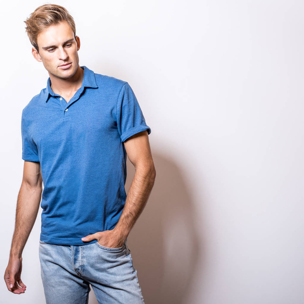 Elegant young handsome man in stylish blue shirt. - Foto, Imagem
