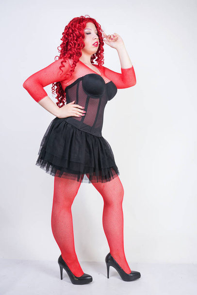 Portrait of redhead sexy woman wearing black corset - Foto, Imagem