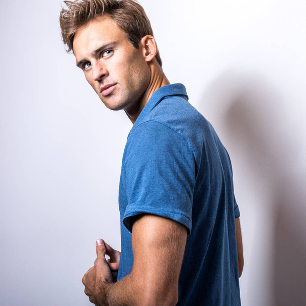 Elegant young handsome man in stylish blue shirt. - Foto, Imagem