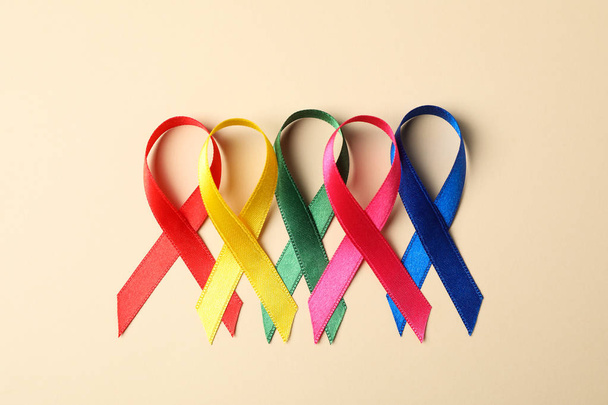 Flat lay composition with awareness ribbons on color background, - Fotografie, Obrázek