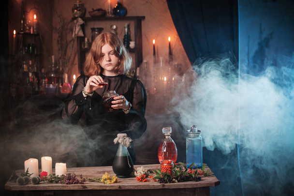 young witch in home. Halloween concept - Foto, imagen