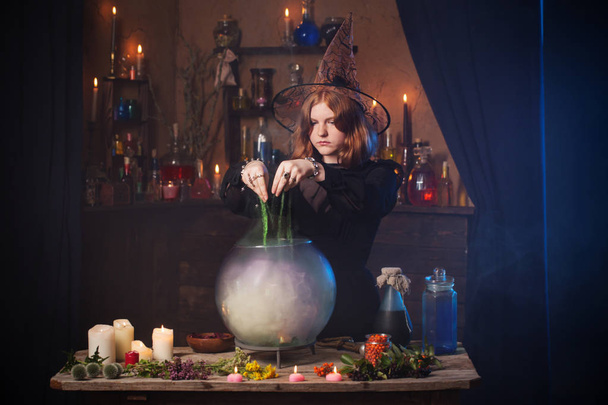 young witch in home. Halloween concept - Фото, зображення