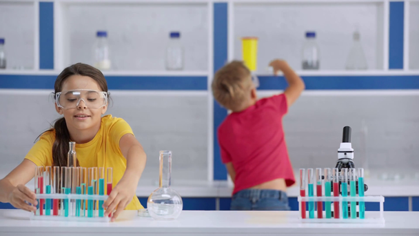 rack focus of happy kids in laboratory  - Footage, Video