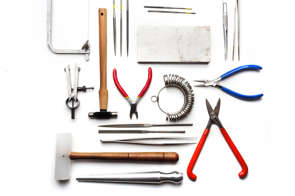 Top view of goldsmiths tools, jewelry objects. Tools over white background - Foto, immagini