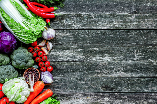 Healthy food. Vegetables and fruits.Organic vegetables on wood.T - Фото, изображение
