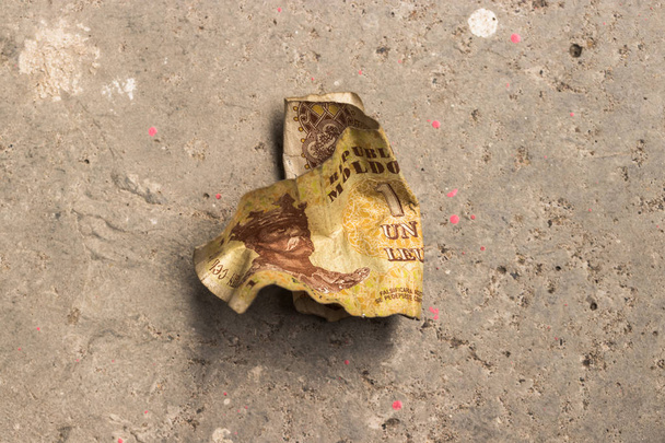 Crumpled banknote of the Republic of Moldova - LEU on the concrete floor. - Photo, Image