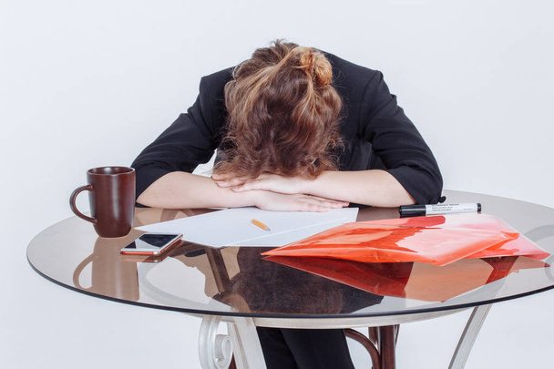 Tired woman feeling pain after sedentary computer work in uncomfortable posture or office chair, exhausted female student or employee leaned on the table, sitting at workplace - Foto, Imagem