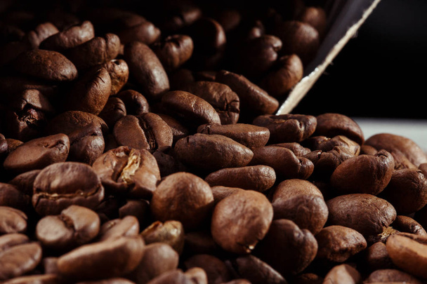 Isolated coffee bean. closeup photo. Top view. Roasted coffee beans background - Valokuva, kuva
