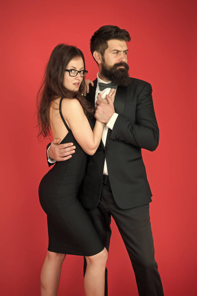 Bearded man wear suit girl elegant dress. Formal dress code. Visiting event or ceremony. Couple ready for award ceremony. Corporate party. Award ceremony concept. Elegance is not about being noticed - Fotó, kép