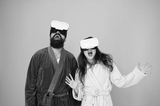 Future life. Good morning. Couple in love. Family. Virtual reality. Love. Happy family in vr glasses. Bearded man and woman in robe pajama. Future is now. Future technology. Vr glasses is our future - Fotó, kép