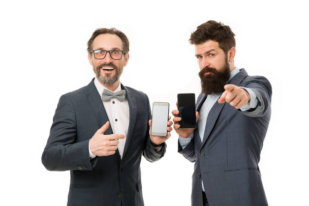 best device for you. mature men. Agile business. partnership of men speaking on phone. bearded businessmen in formal suit. business communication on meeting. team success. collaboration and teamwork - Valokuva, kuva