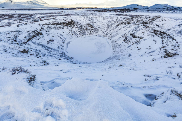 Panoramic view of the Kerid Volcano Iceland with snow and ice - Photo, Image