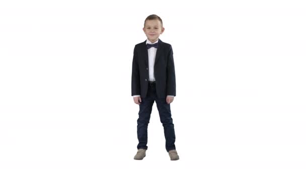 Smiling little boy in formal clothes standing on white background. - Footage, Video