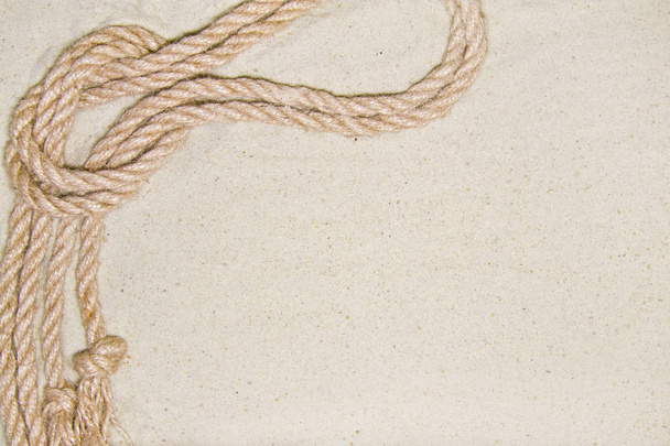 rope on sand as background top view with place for text - Foto, Imagen
