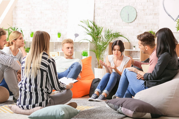 People calming woman at group therapy session - Photo, Image