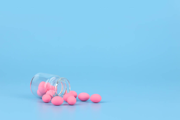 decorated pink easter eggs in bottle with blue background - Foto, afbeelding