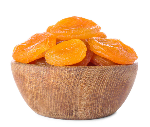 Миска зі смачними сушеними абрикосами на білому тлі
 - Фото, зображення