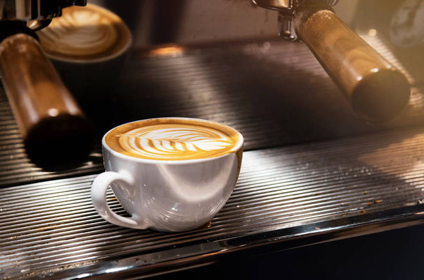 latte coffee in coffee shop, Coffee latte art in coffee shop caf - Foto, Bild