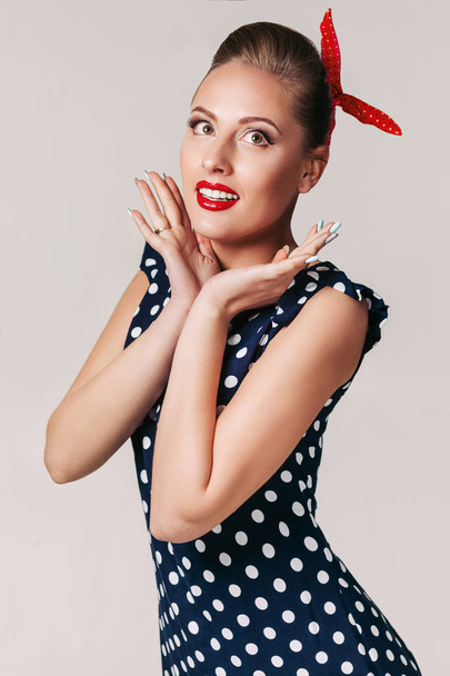 portrait of pin up woman in polka dot dress. - Photo, Image