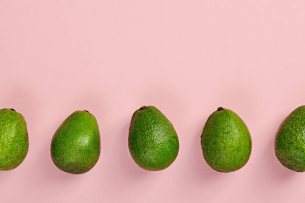 Avocado pattern on color background - Foto, afbeelding