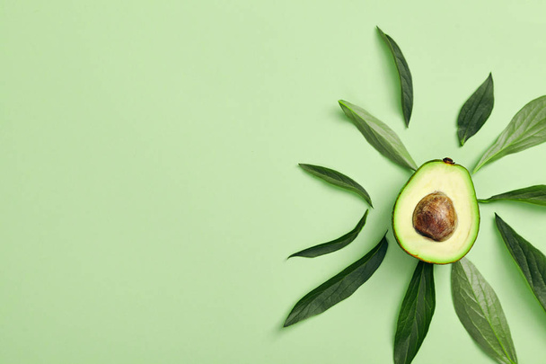 Slices of avocado on color background - Photo, Image