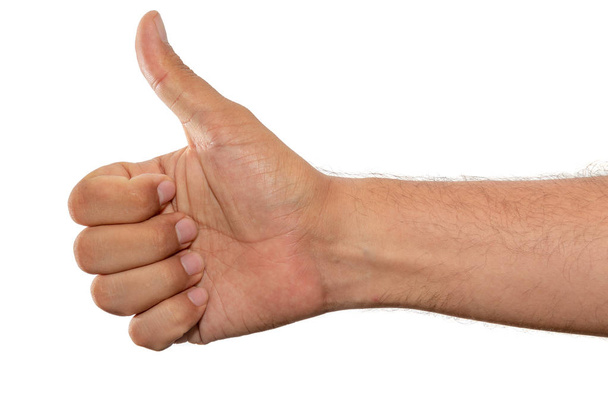 Hand with fingers set into thumbs up gesture. Isolated on a whit - Photo, Image