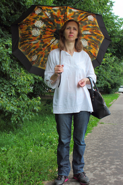 Mujer con un parasol
 - Foto, Imagen