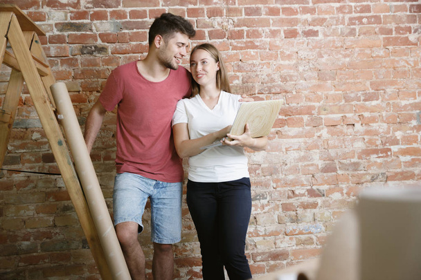 Young couple doing apartment repair together themselves - Photo, Image