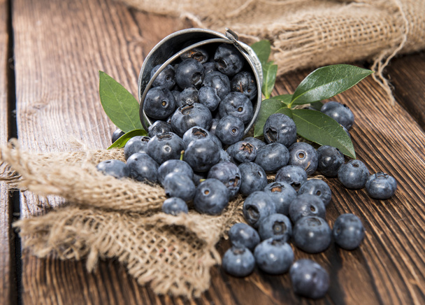 Some Blueberries in a small Bucket - Foto, Imagen