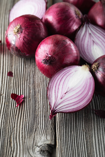 red onions on rustic wood. Red onion halves. Food Ingredients - Photo, Image