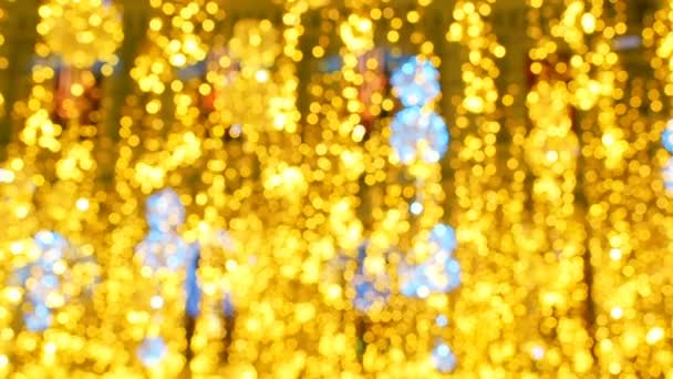 Bright Christmas Street Illumination. The City is Decorated for the Christmastide Holiday. New Year Lights Decorating Shimmering bokeh. Bright festive Christmas abstract background of twinkling - Footage, Video