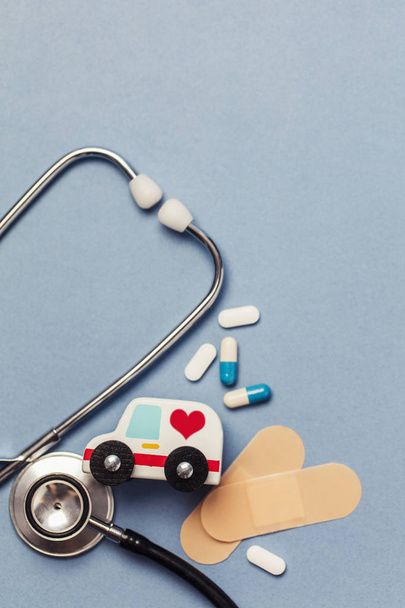 Healthcare background with stethoscope and ambulance - Foto, Imagem