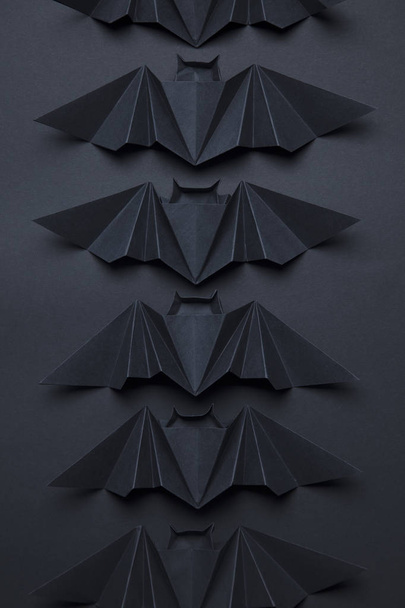 Halloween spooky dracula bats background made from origami - 写真・画像