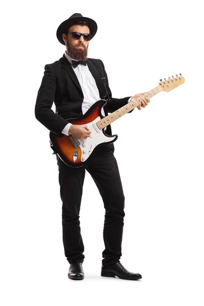 Male guitarist in a suit - Fotó, kép