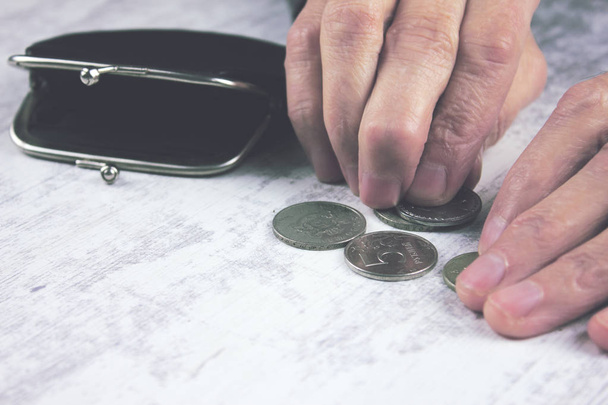 Senior woman counting coins  - Φωτογραφία, εικόνα