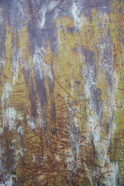 Näkymä vanha ruosteinen värillinen metalli säröillä maali, grunge tausta
 - Valokuva, kuva