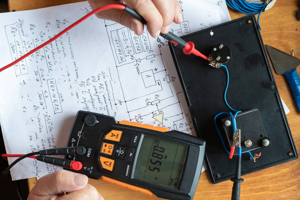 process of making electrical measurements with multimeter, testing the equipments - Photo, Image
