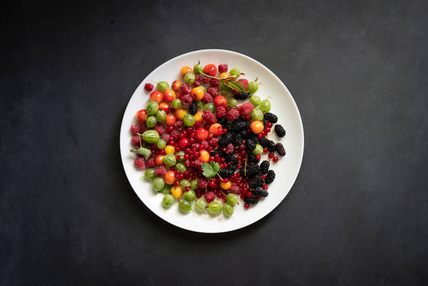 top view of a plate with lots of fresh raw berry - Photo, Image
