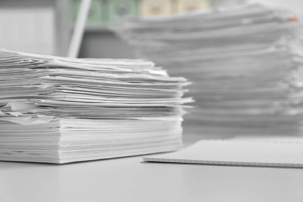 Stacks of documents on table in office - Valokuva, kuva