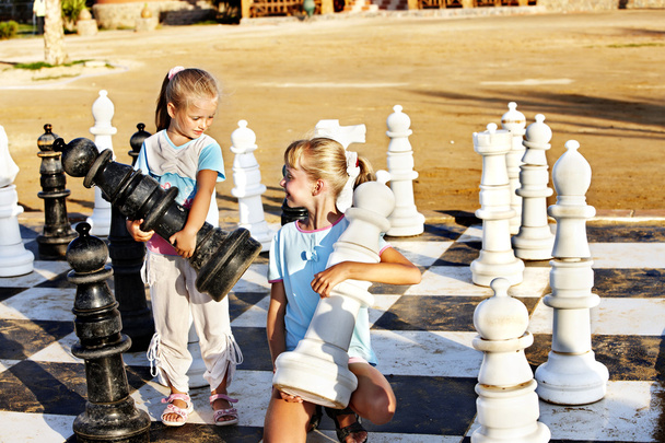 Children play chess outdoor. - Photo, Image