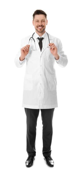 Full length portrait of smiling male doctor isolated on white. Medical staff - Foto, Imagem
